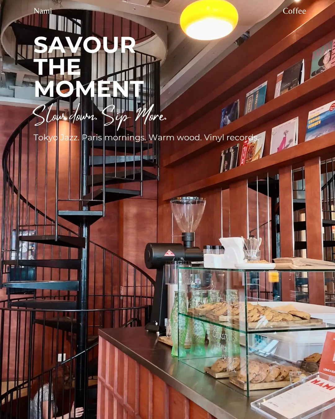 Inside Nami: the black spiral staircase, red-brown wood and shelves of vinyl records.